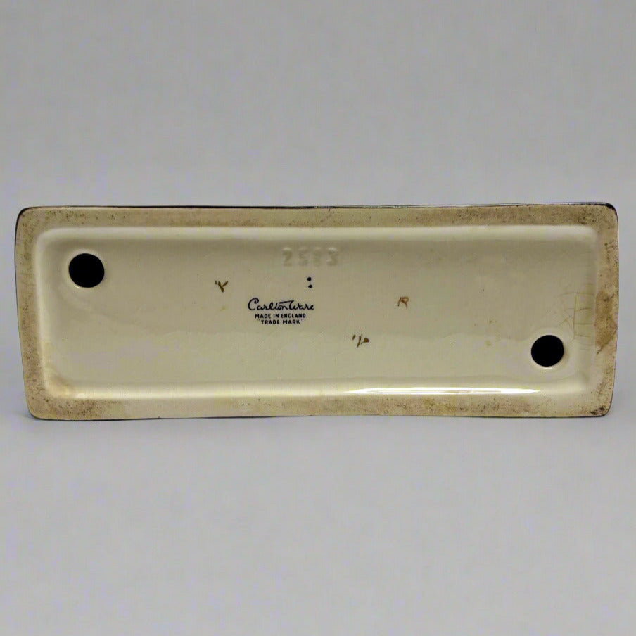 Rectangular ceramic dish with 'Ceramiche' branding on a white background