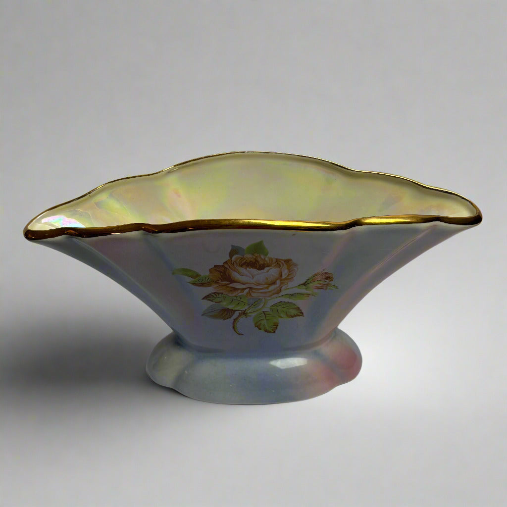 Decorative ceramic bowl with floral design on a plain background