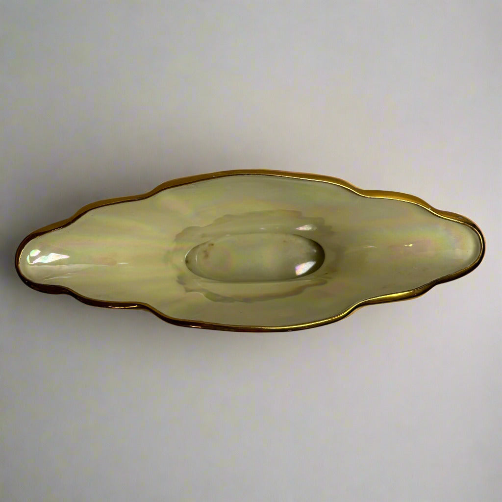 Decorative ceramic vase with gold rim on a white background