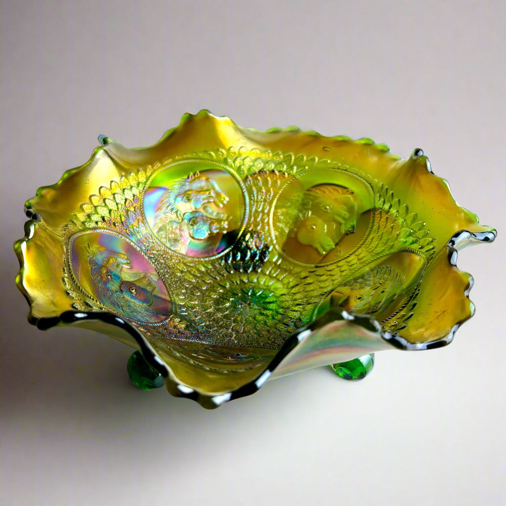 Decorative glass bowl with fish design on a white background