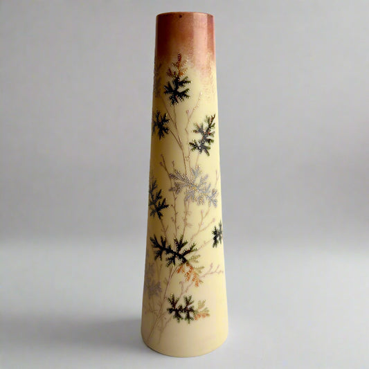 Decorative vase with floral patterns on a plain background