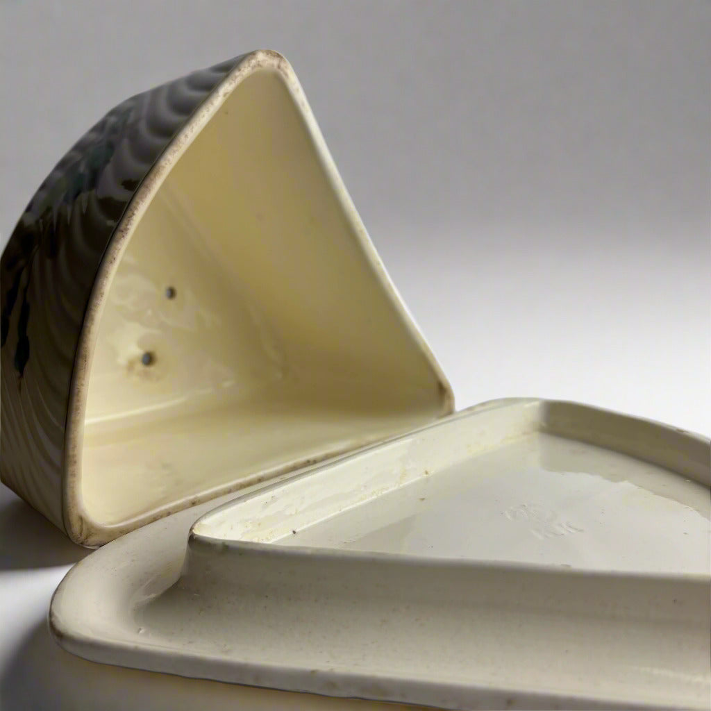 Ceramic container with a lid on a gray background
