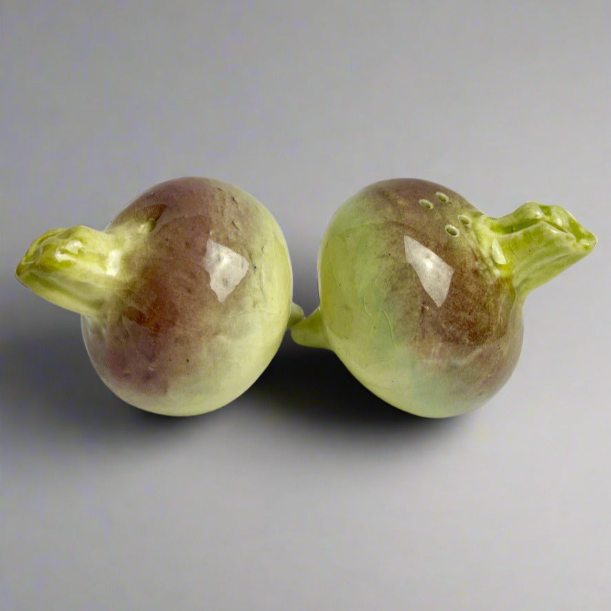 A pair of onion-shaped salt and pepper shakers with a marbled purple and beige color.