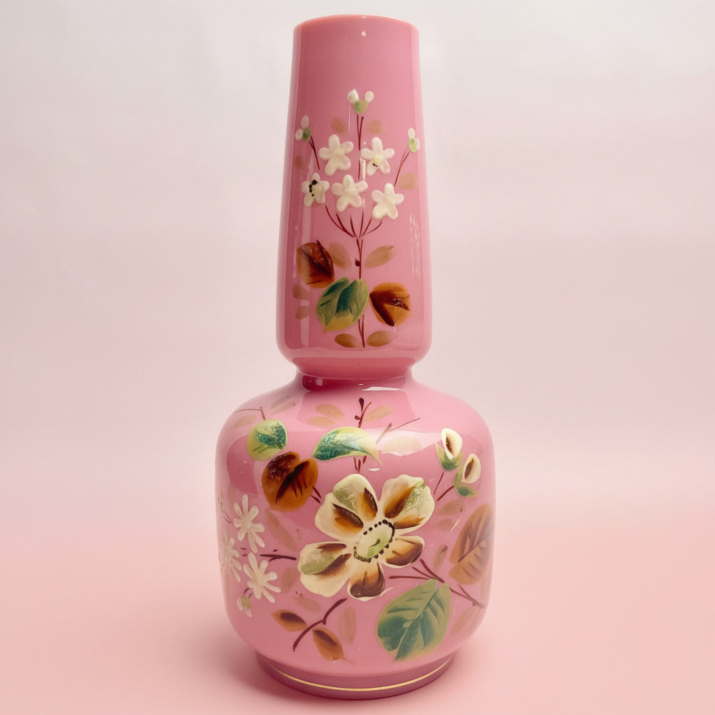 Pink floral bottle on a white background