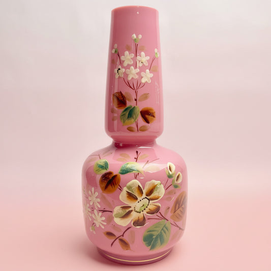 Pink floral bottle on a white background