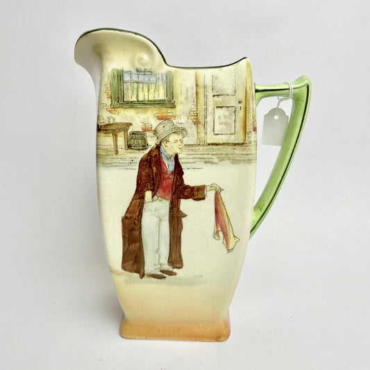 Royal Doulton Dickens Ware The Artful Dodger Jug with a colorful illustration of a character from 'Oliver Twist' on a green background.
