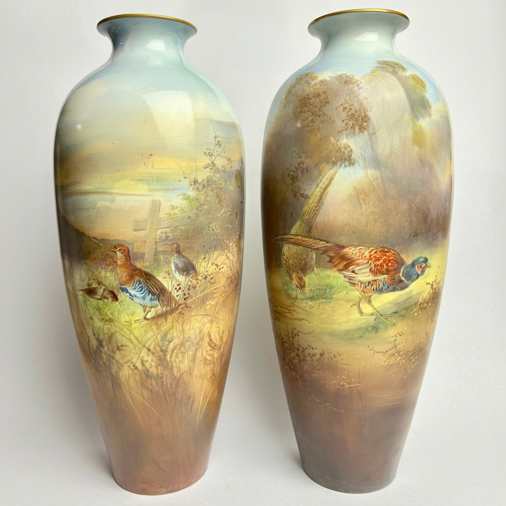 A pair of hand-painted ceramic Winton vases with a rural scene featuring pheasants.